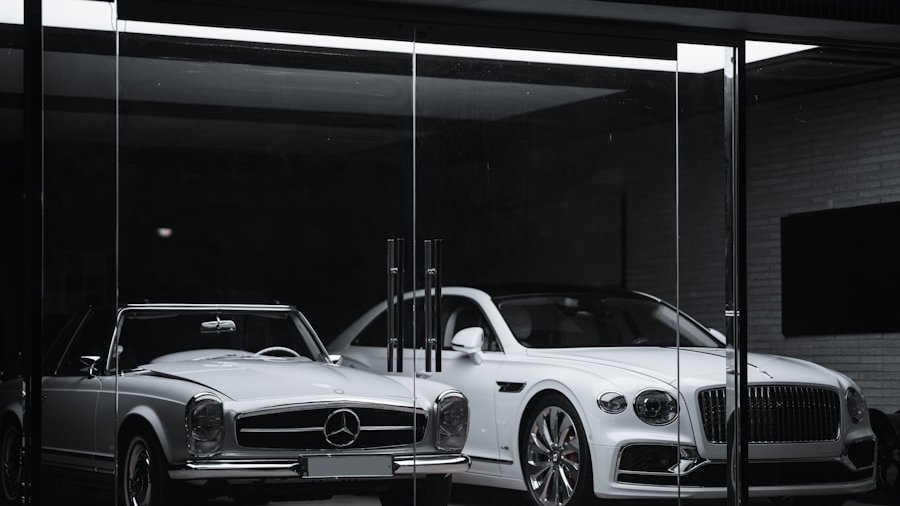 A vintage Mercedes-Benz and a modern Bentley parked behind a glass storefront